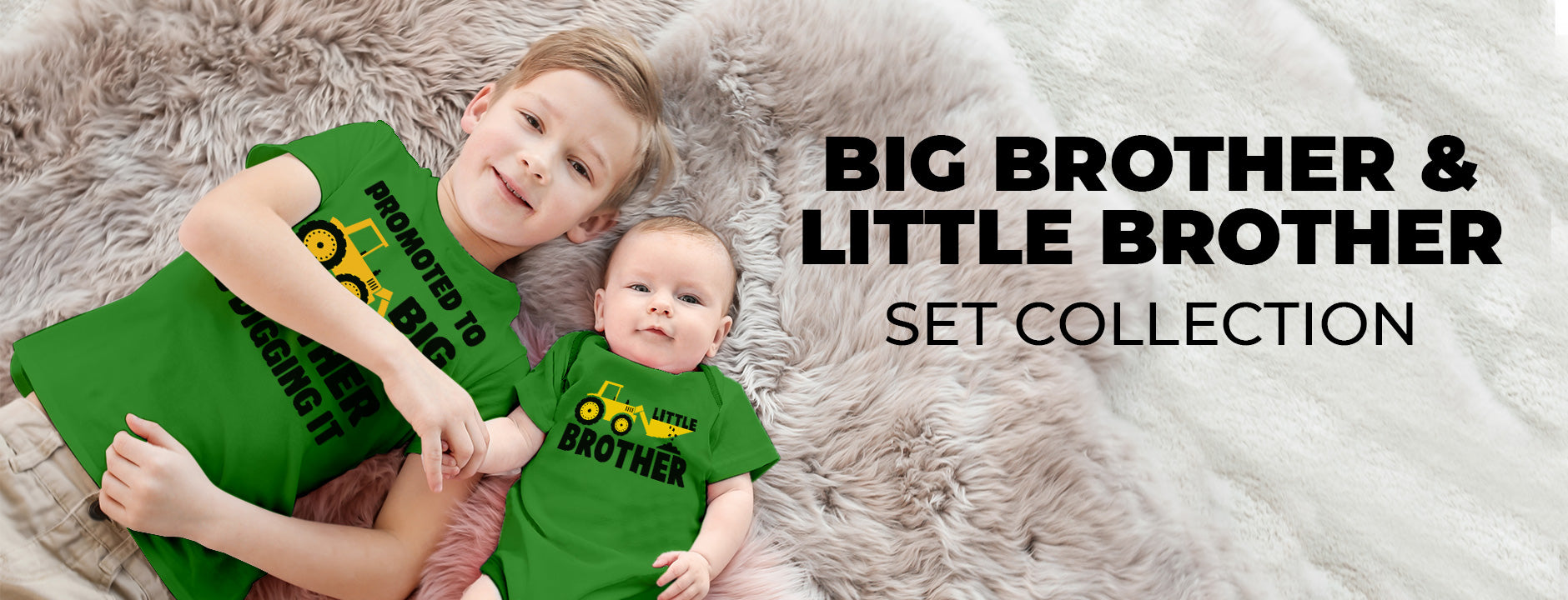 two brothers smiling and wearing a big brother and little brother set in green