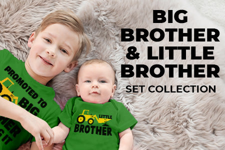 two brothers smiling and wearing a big brother and little brother set in green